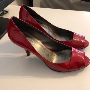 Red peep toe pumps